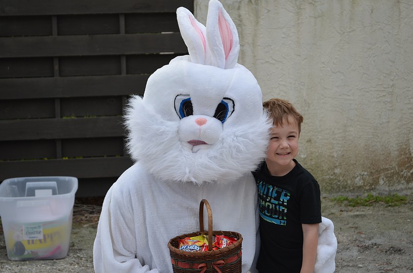 Tanner North takes his turn to pose with the Easter bunny.