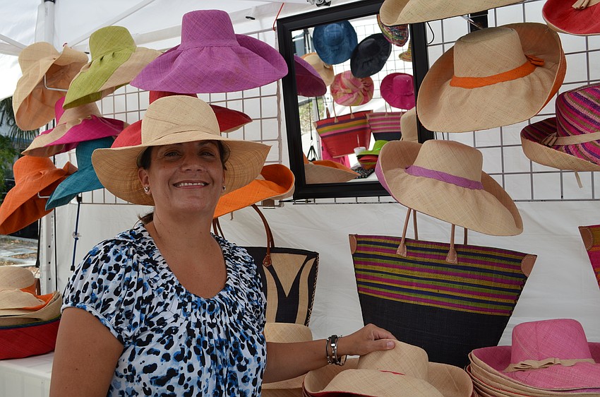 Annemarie Steinwarz with her stand of hats from Madagascar.