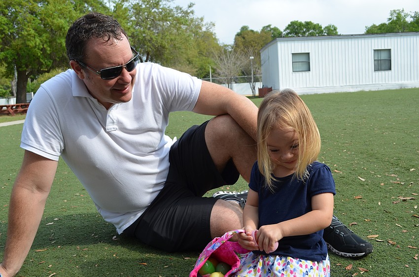 Grier Turnbull goes through her Easter eggs with her father Peter.