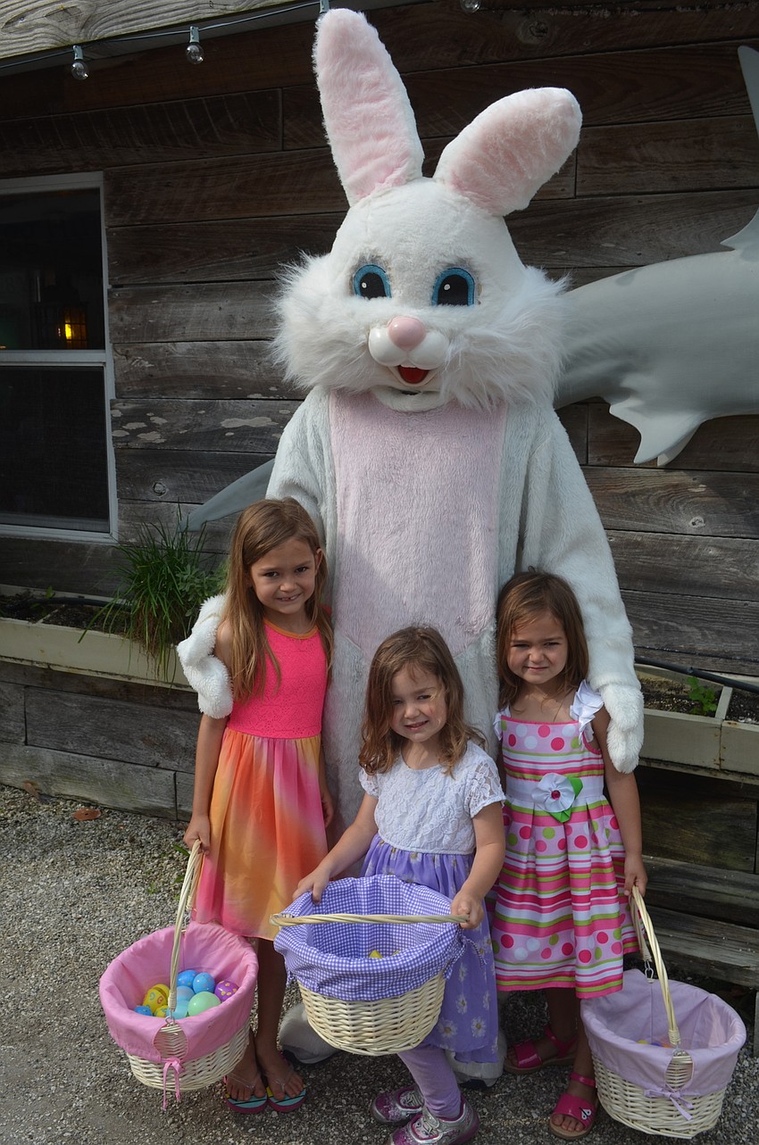 Julia Mulligan, 7, and sisters, Kayte, 3, and Kiley, 5, with the Easter Bunny