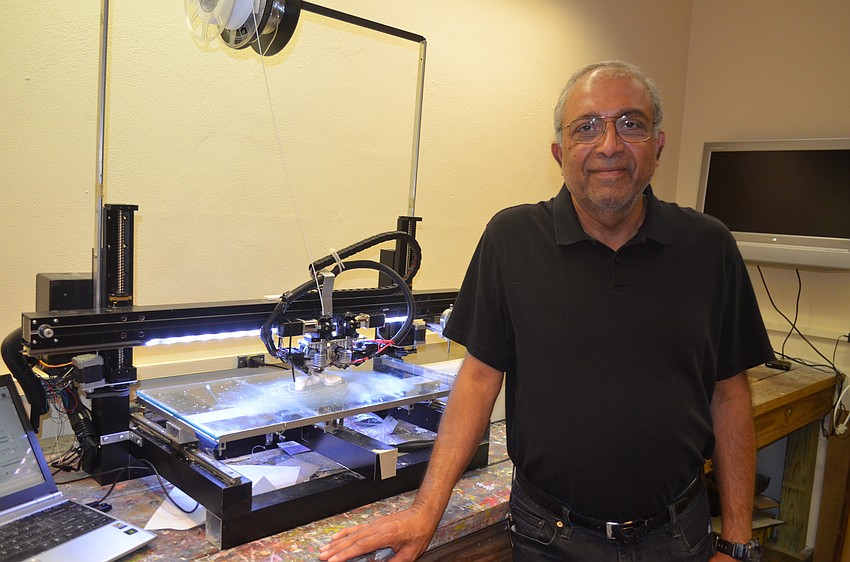 Artist Ravi Venkataraman with his 3D printer