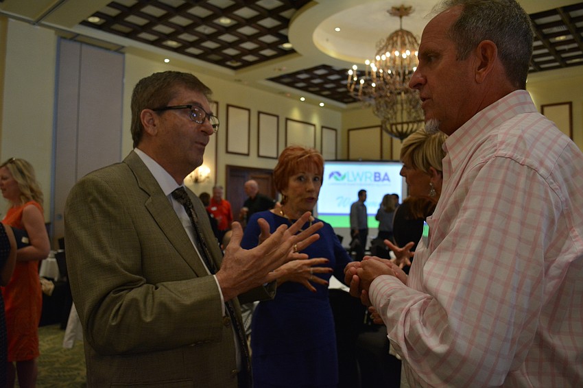 Dave Minton, of One Sarasota Realty Group, and with John Bradshaw, of Lyteworks