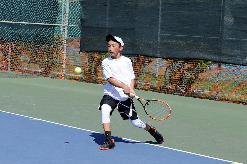 Sarasota's Ben Lee sends the ball back over the net during his No. 5 singles semifinal.