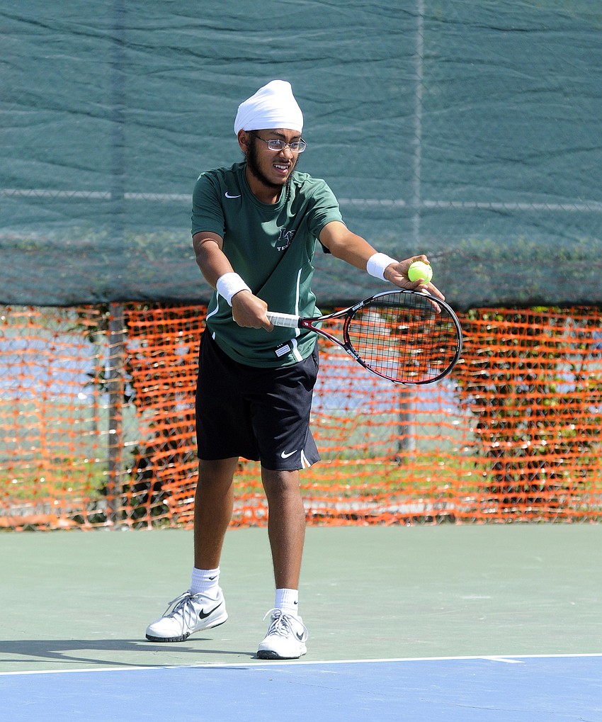 Lakewood Ranch senior Balwant Singh prepares to serve the ball during the Class 4A-District 8 tournament March 30.