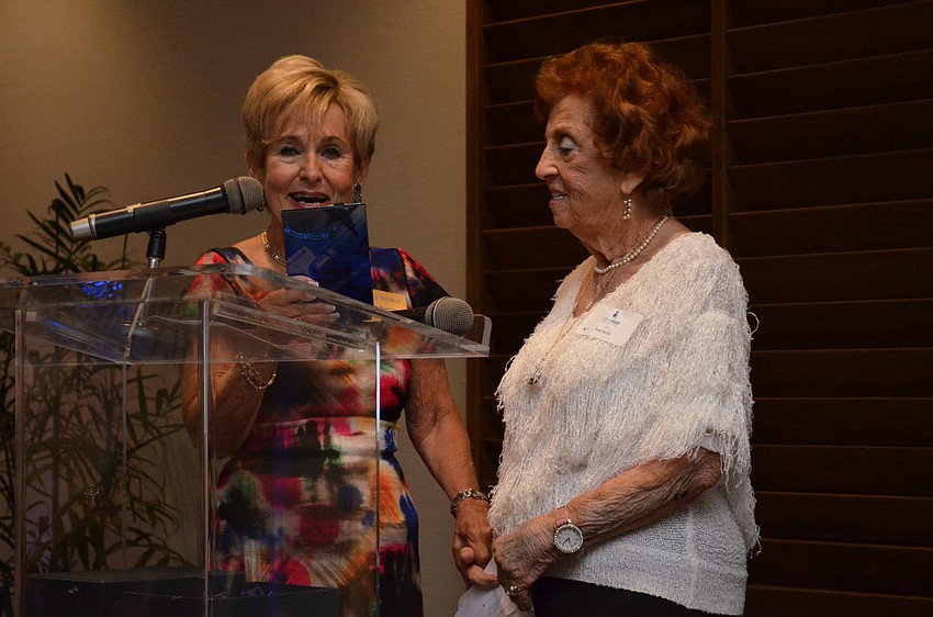 Bunny Skirboll recognizes Ann Hartka with the award for Outstanding Board Member.