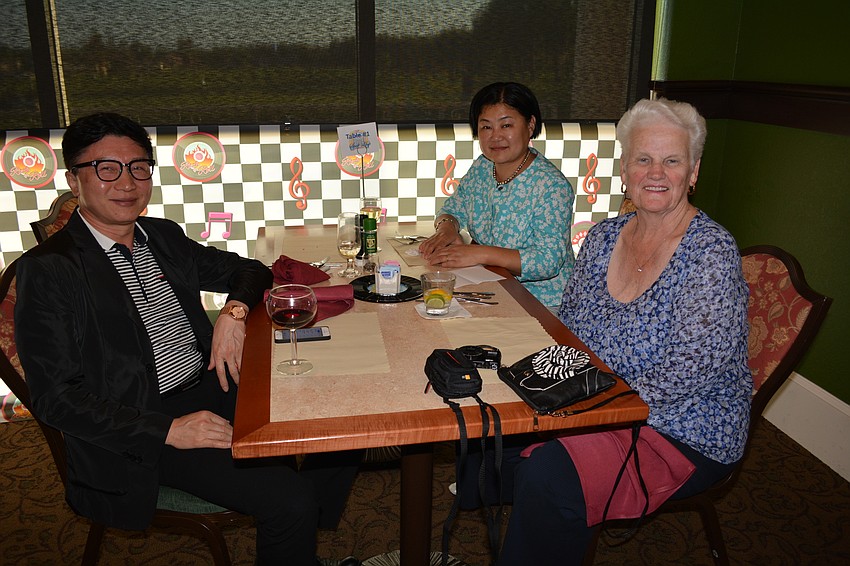 James Jang and Amber Wei join Judy Strobhar, front right.