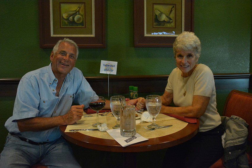 Ken Hawthorne and Marsha Wright share a sundae.