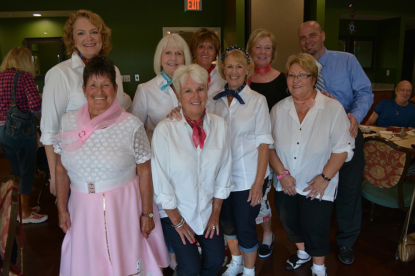 Members of the social committee have Clubhouse Manager Warren Lee commemorate the night.