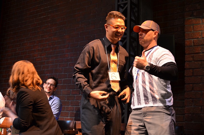 Rob Young is escorted off the stage by Refer-bee Adam Hughes after failing to spell 