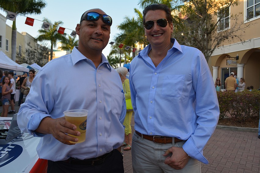 Billy Olivieri and Eugen Aldea grab some drinks.