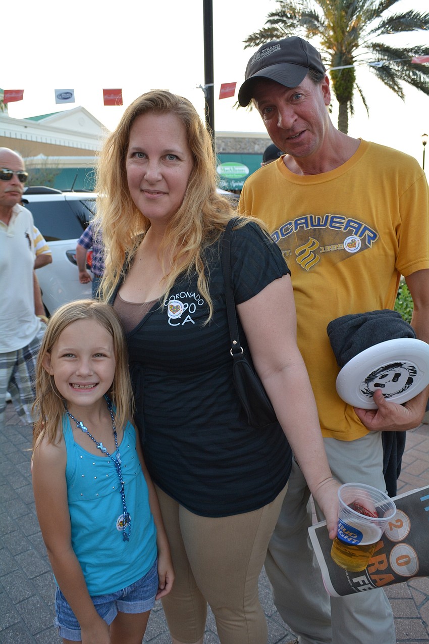 Greenfield Plantation residents Athena and Joy Coughlan have fun with Jon Hartman.