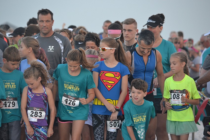 Participants line up for the 30th annual Mote Run for the Turtles 5K.
