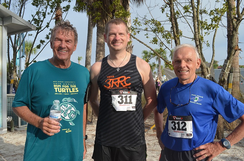 Dean Cutshall with 2nd overall finisher Chris Kaufman and his father Dan Kaufman.