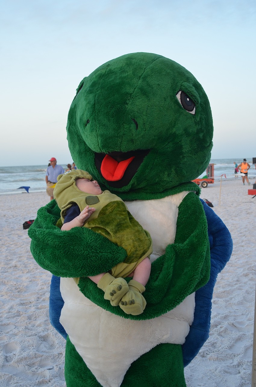 Shelley the turtle with her actual hatchling Connor Jalwan.