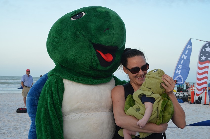 Shelley the turtle with Jamie Jalwan and her hatchling Connor.