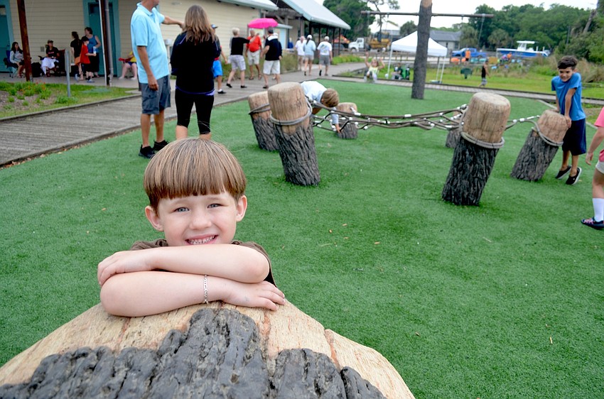 Five-year-old Chance Horvath, of Bradenton, approves of the new playground equipment.