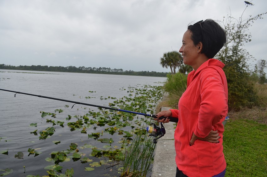 Patricia Riser, of Bradenton, waits for a bite on her line.