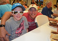 Trenton Tesar and his father, Michael, enjoy family time.