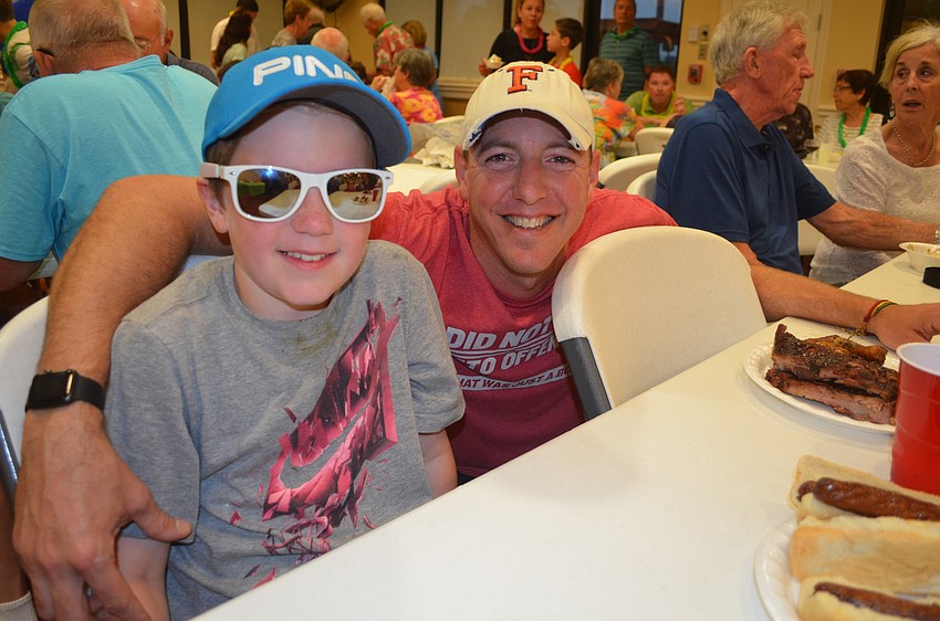 Trenton Tesar and his father, Michael, enjoy family time.