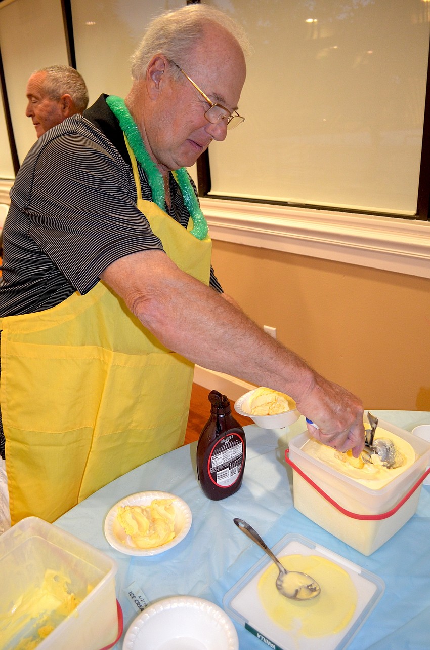 Mike Listro serves up ice cream to guests.