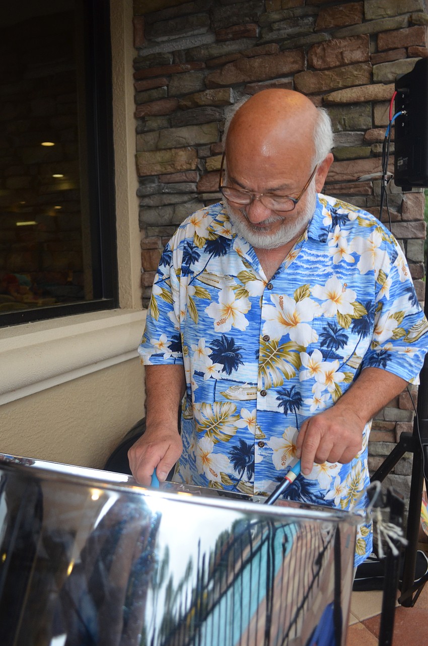 Augie DiGiovanna plays the steel drum.