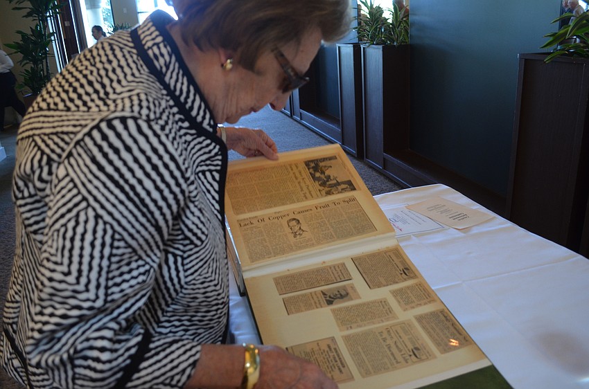Mary Testa flips through a scrapbook tracing the lectures for the Sarasota Institute of Lifetime Learning as far back as 1972.