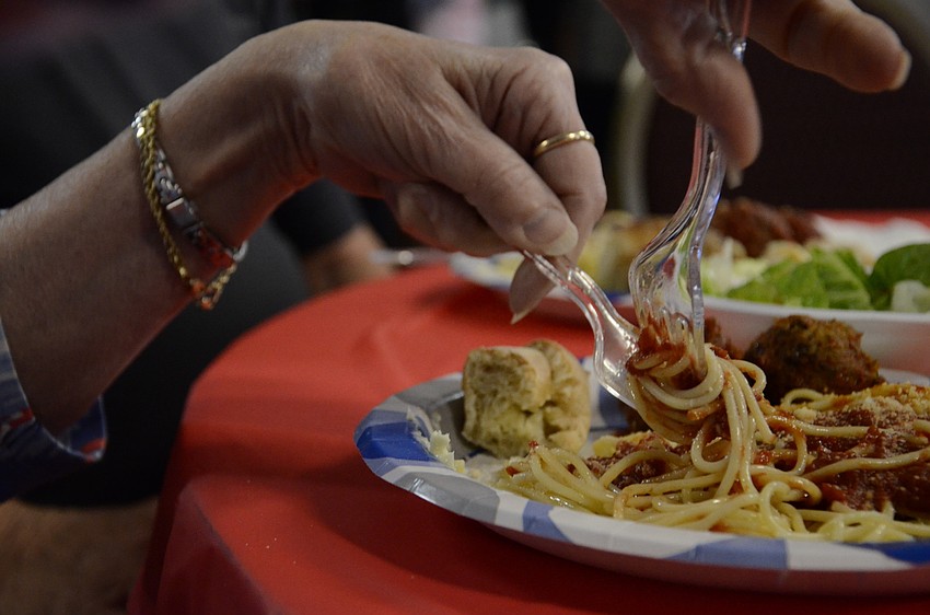 Marty Mork expertly swirls her spaghetti. She said she cuts it sometimes now, but always grew up twirling it.