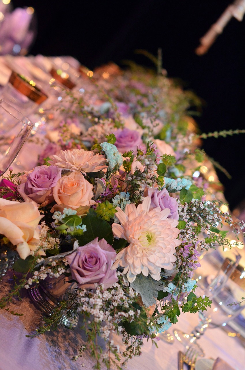 The stage at FSU Center for the Performing Arts was decorated for Asolo Rep's annual Season Celebration on Stage. The decor was themed around a 'rain garden party.'