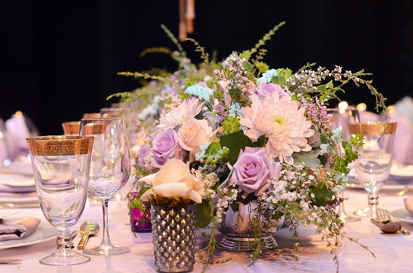 The stage at FSU Center for the Performing Arts was decorated for Asolo Rep's annual Season Celebration on Stage. The decor was themed around a 'rain garden party.'