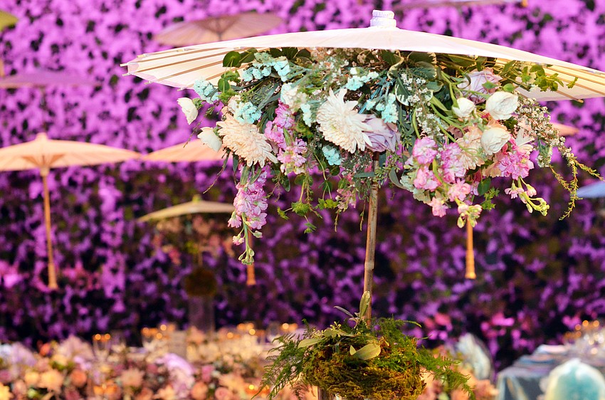 The stage at FSU Center for the Performing Arts was decorated for Asolo Rep's annual Season Celebration on Stage. The decor was themed around a 'rain garden party.'