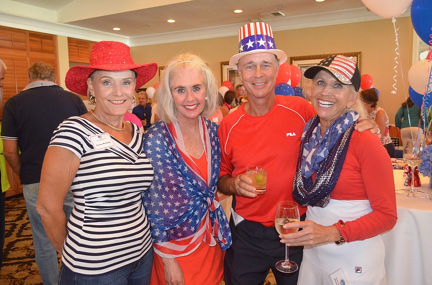 Committee members Sunny McGrath, Sandy Schonhoff, and auctioneer David and Marcia Gutridge
