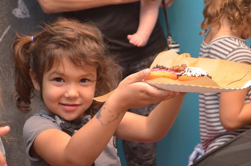 Alessia Zampol is proud of her finished doughnuts.