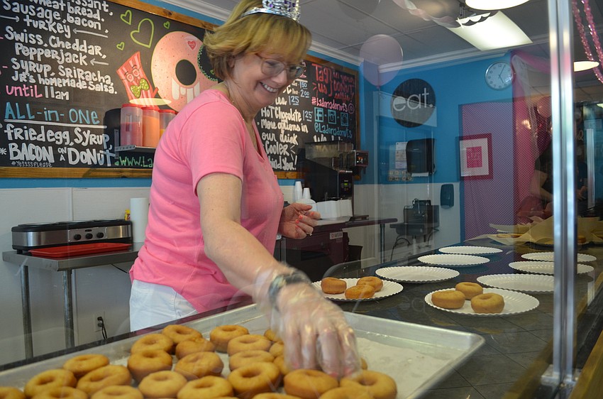 Glenda Riteff sorts more than 200 mini doughnuts.