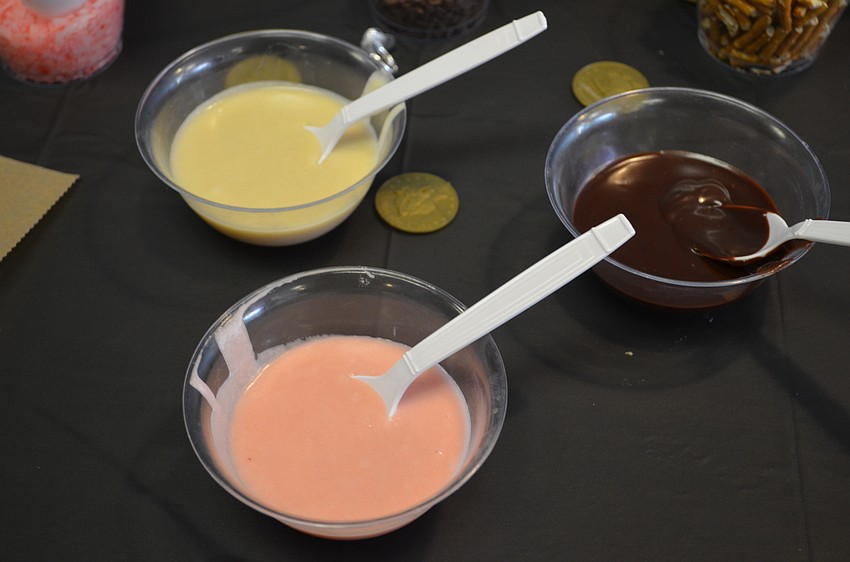 Three glazes and seven toppings like pretzels, Cocoa Puff cereal and sprinkles were on the table for the evening.