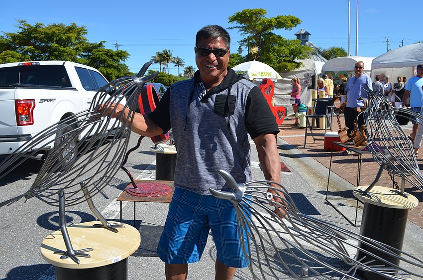 Lorenzo Ortega with his metal sculptures he calls 