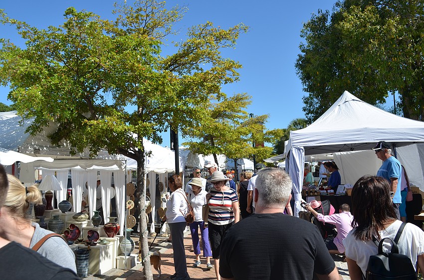 This year booths lined the sidewalks down Ocean Boulevard in the Siesta Key Village.