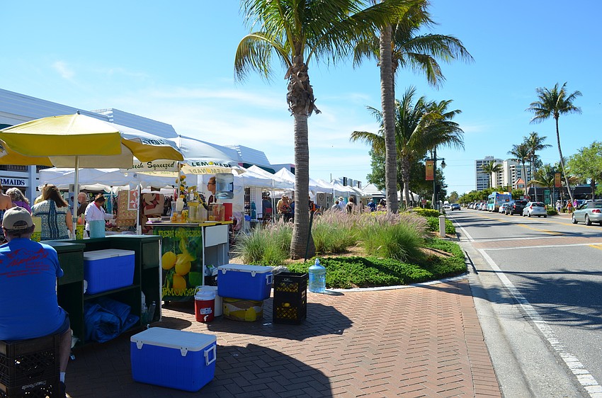 This year booths lined the sidewalks down Ocean Boulevard in the Siesta Key Village.
