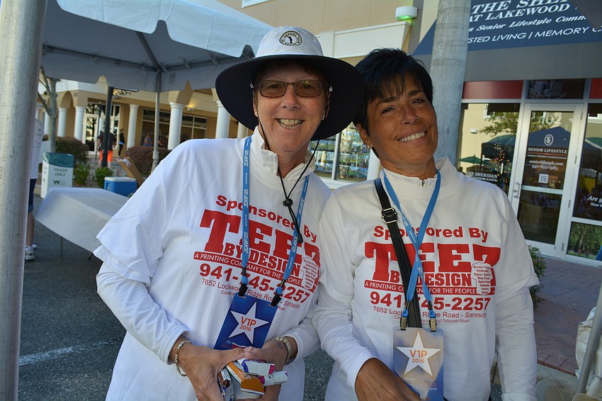 Becky Romich and Nancy Kornberger, team captain, walk with more than 30 others from the Palm Aire Country Club Partners team.