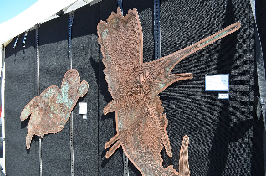 A green sea turtle and sailfish copper etchings by Robin Marsh.