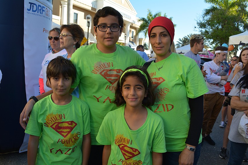Yazid, Karem and Ismail Masam join their mother, Sarah.