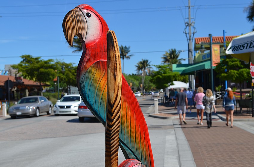 A wooden sculpture by Steve Umphrey at the intersection of Ocean Boulevard and Canal Road.