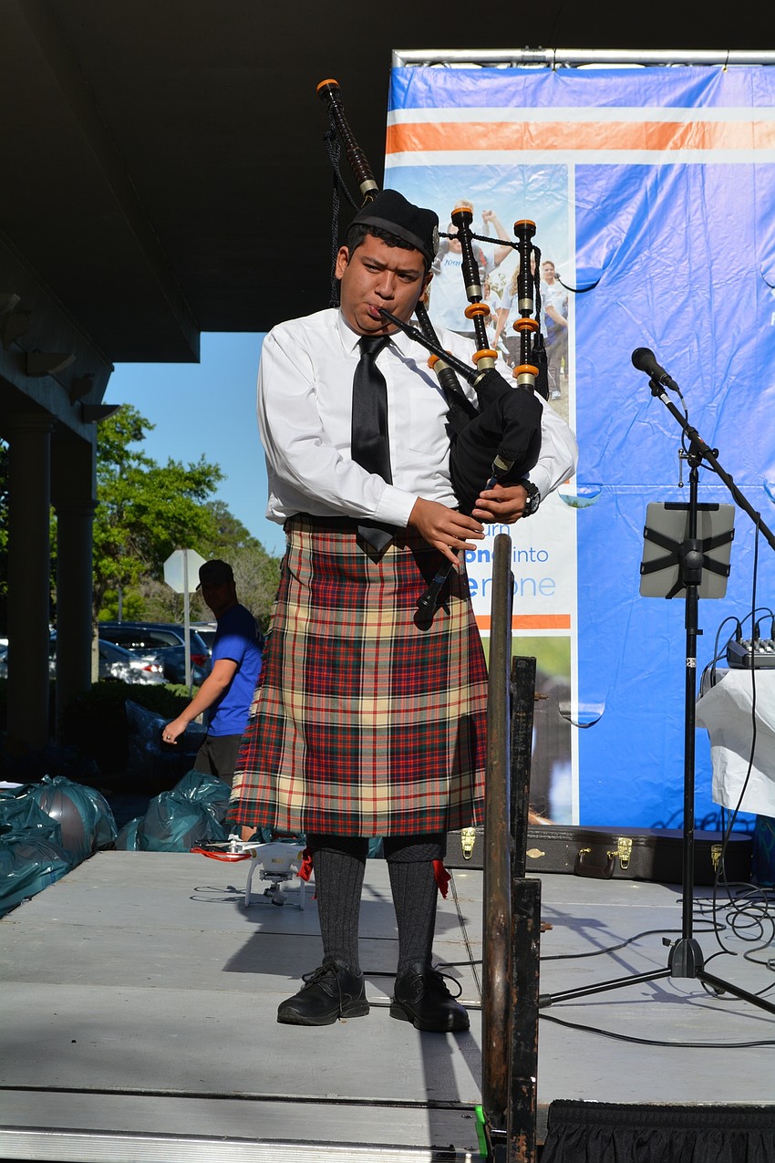 Riverview High's Carlos Garcia performs a solo before the walk begins.