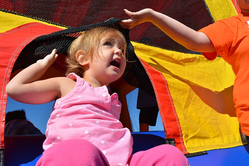 Amyia Riley, 2, tries out the bounce house.