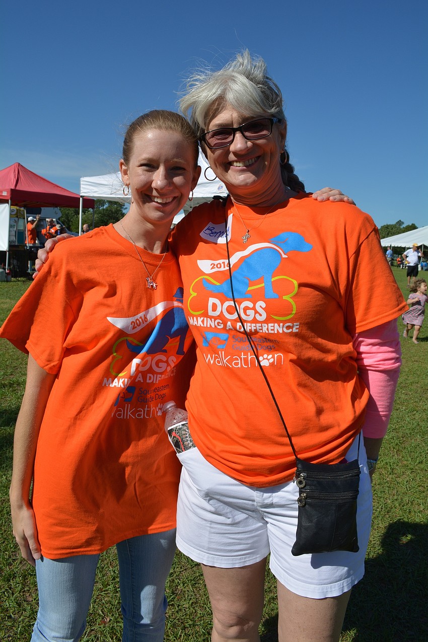 Lakewood Ranch's Erin Papke takes a break from being the mascot, Scout, with her friend and 