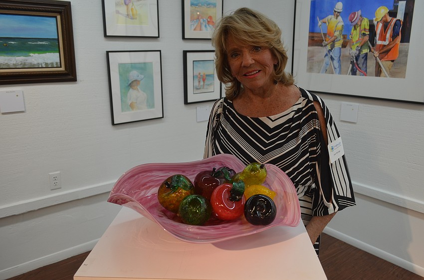 Artist Joan Partridge with “Fruit Blow Out!”