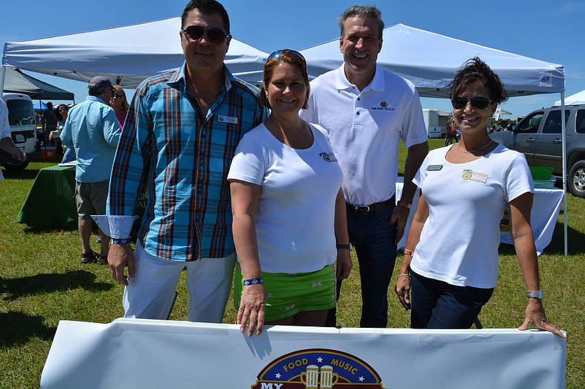 Tim Mitten, Natalie Russell, Dave Marcinko and Karie Gorgone represent Wagner Realty, an event sponsor.