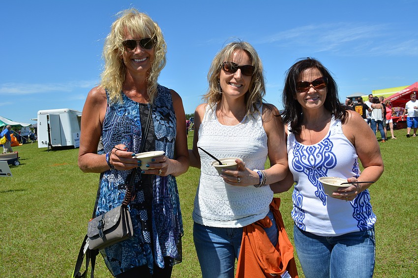 Debby Greer, Pam Plank and Crystal Yoder are enamored with their sample from Chicken Kitchen.