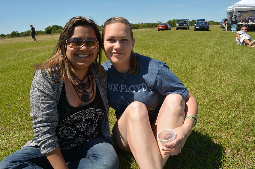 Sisters-in-law Sam Anzures and Jenny Anzures enjoy beer and music.