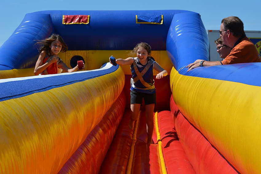 Megan Ponce and Rachel Tuck, both 11, race each other.