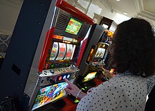 Maxine Greenberg takes her chances on the slot machines.